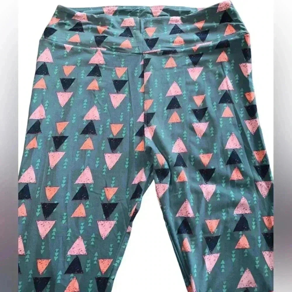 Lularoe TC dark sage green leggings. Graphic pattern OG designer Patrick fit